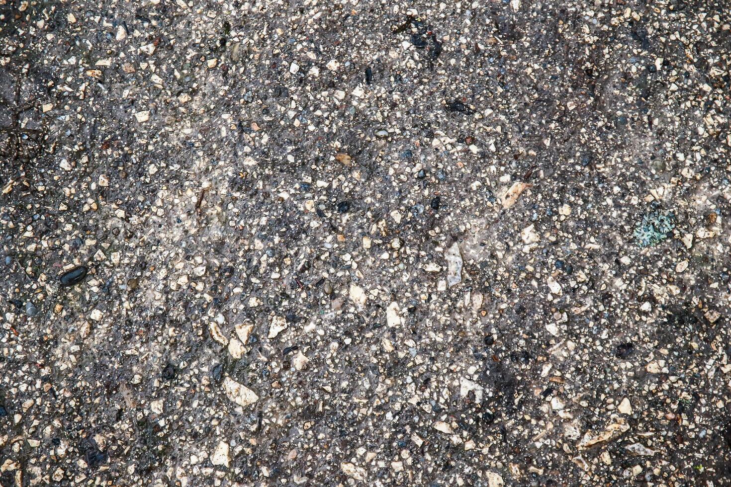 A close up of a dirty concrete surface photo