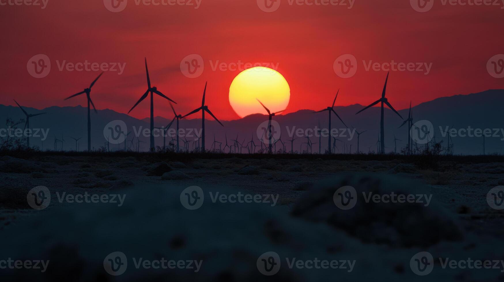Wind turbines at sunset in the desert photo