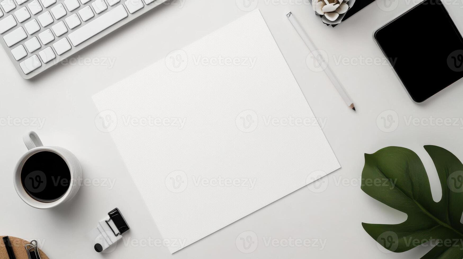 clean workspace with blank sheet of paper, coffee, and stationery photo