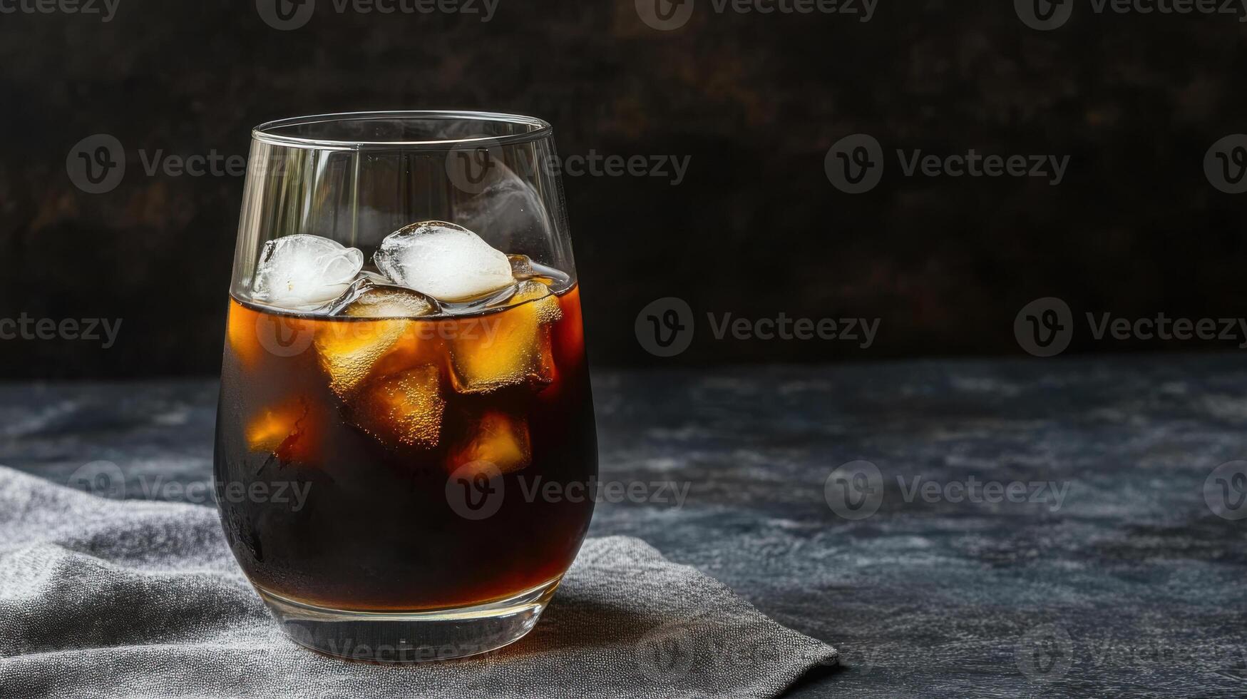 Iced coffee in a tall glass with ice cubes photo