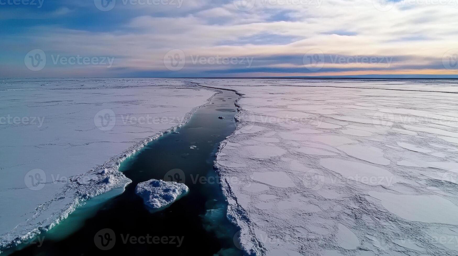 Aerial view of frozen landscape with winding waterway through ice photo