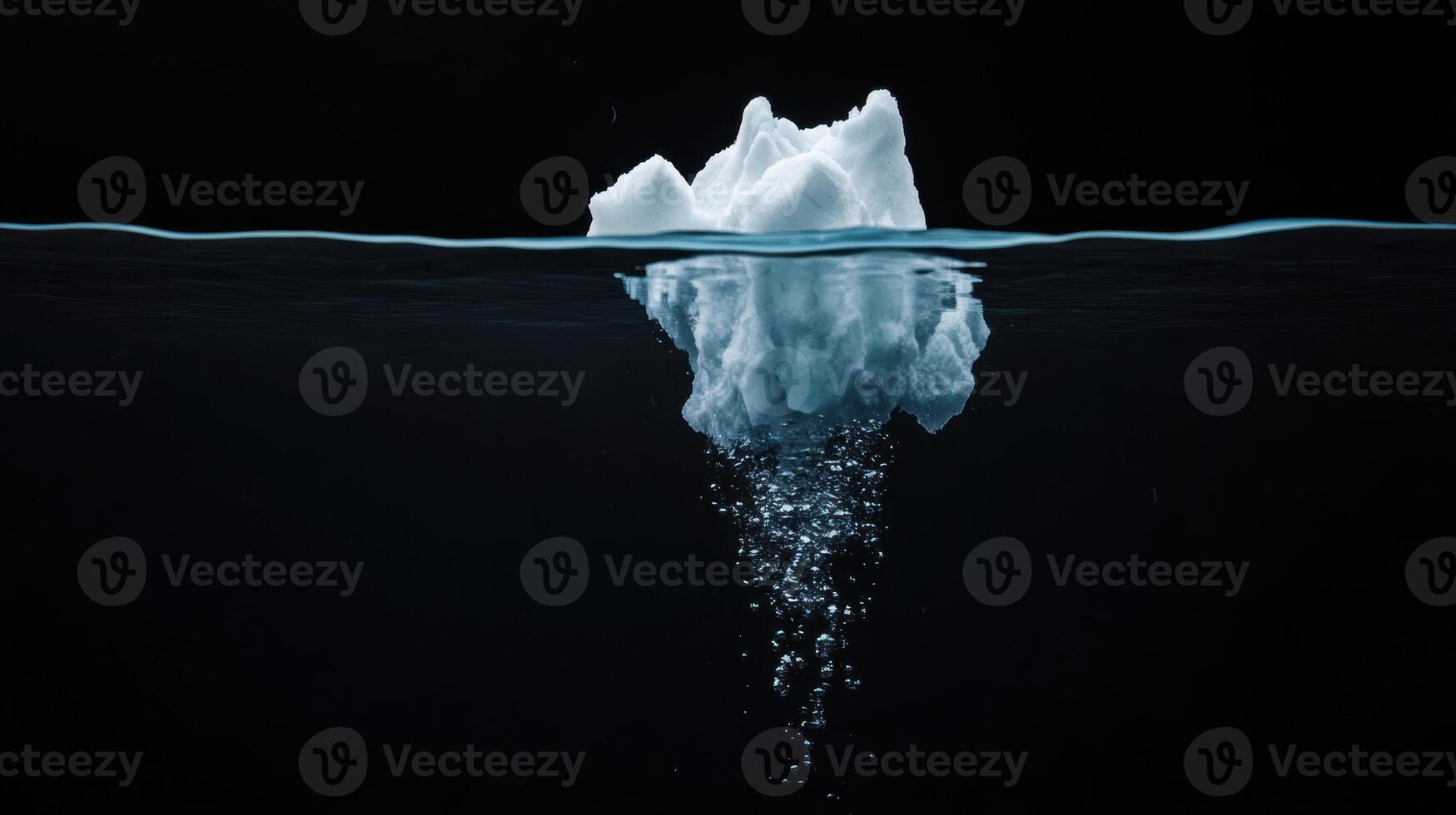 Melting iceberg with bubbles rising in dark water, showcasing climate change photo