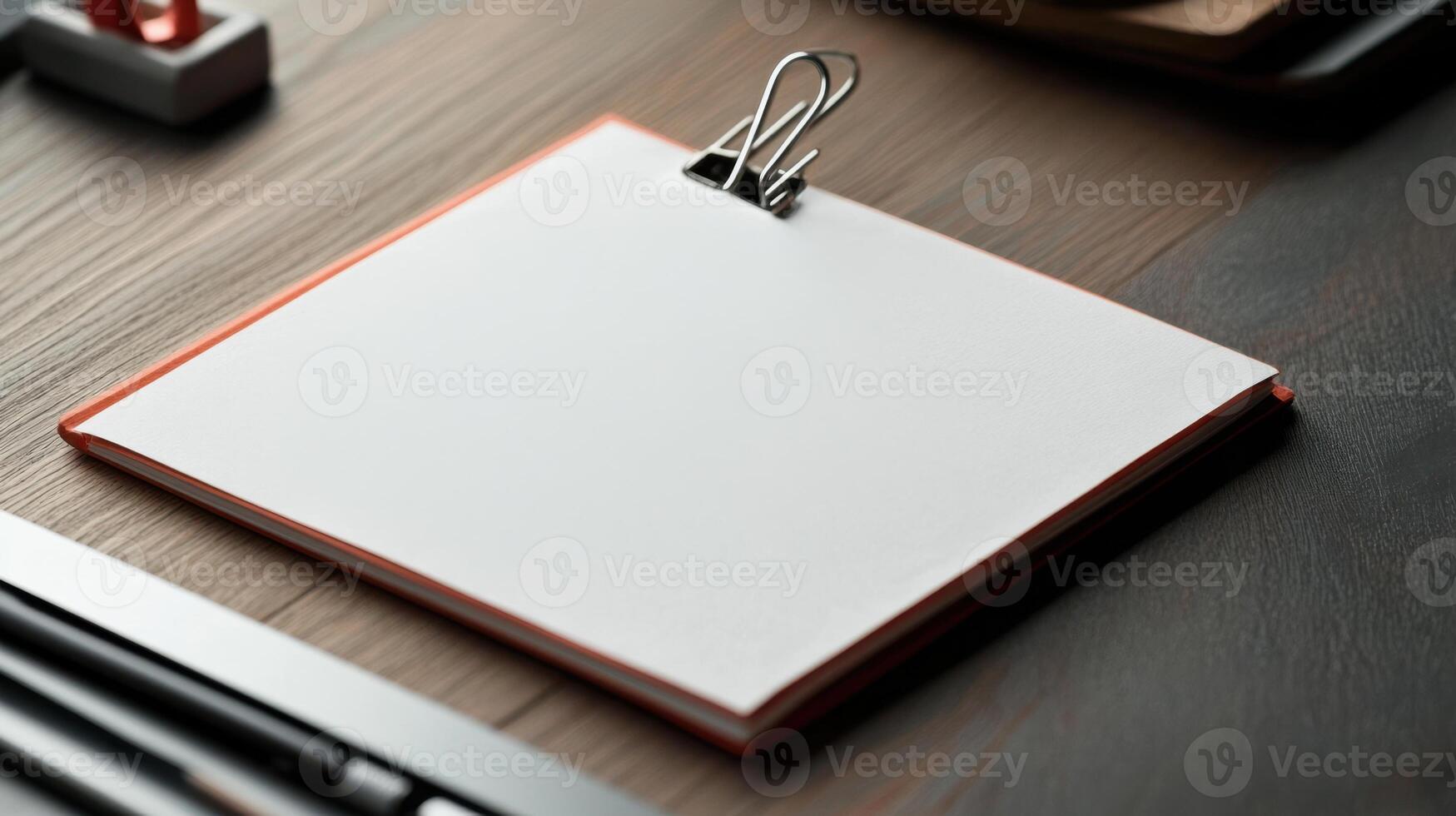 Blank notepad on desk with pen and pencil photo