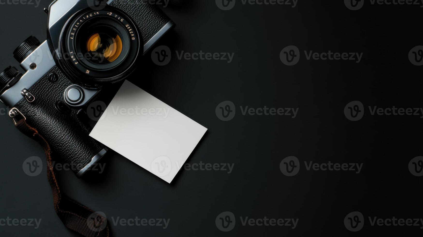 vintage camera with blank card on dark surface, ready for notes photo