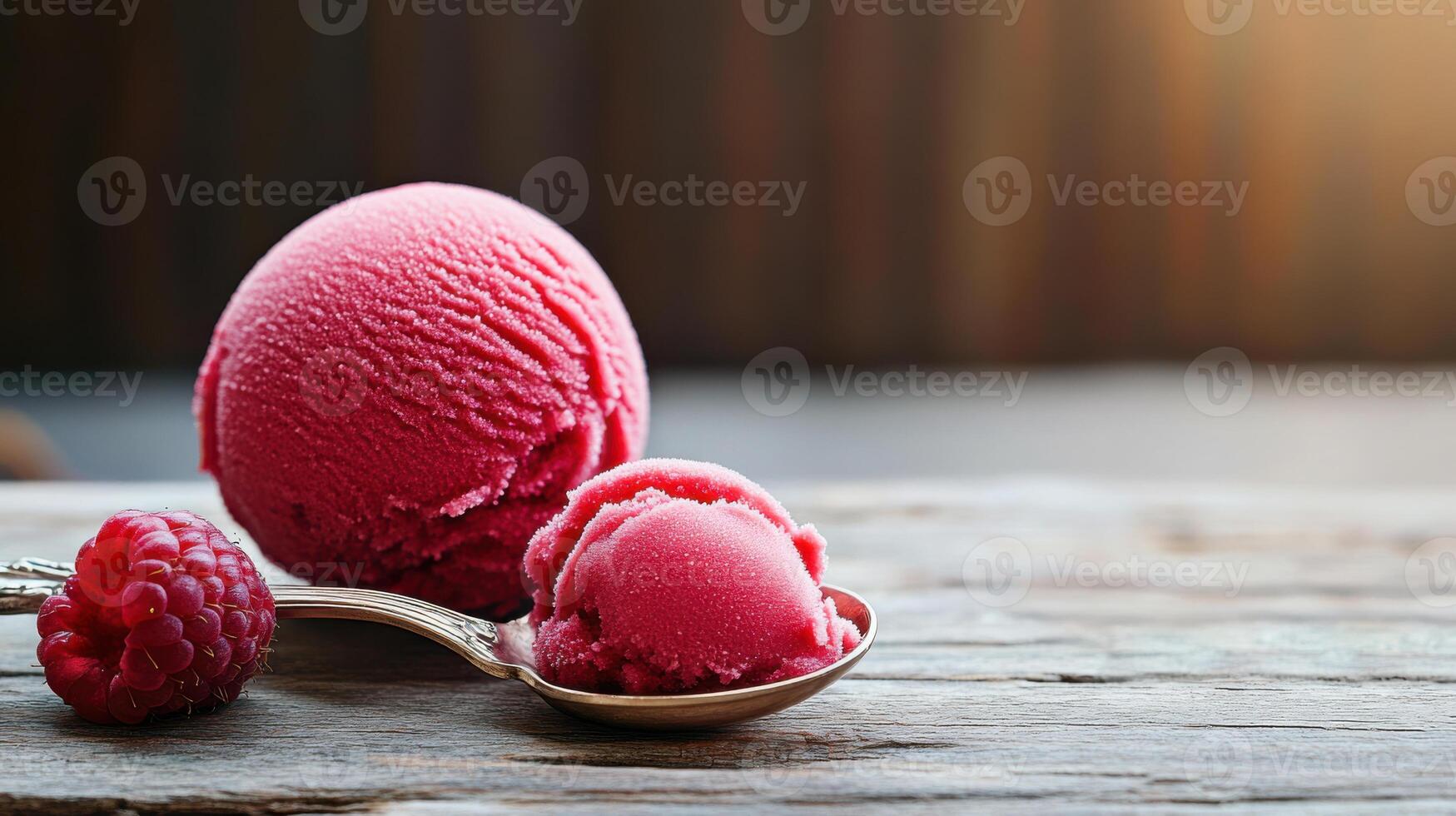 scoop of raspberry sorbet on delicate spoon with berries photo