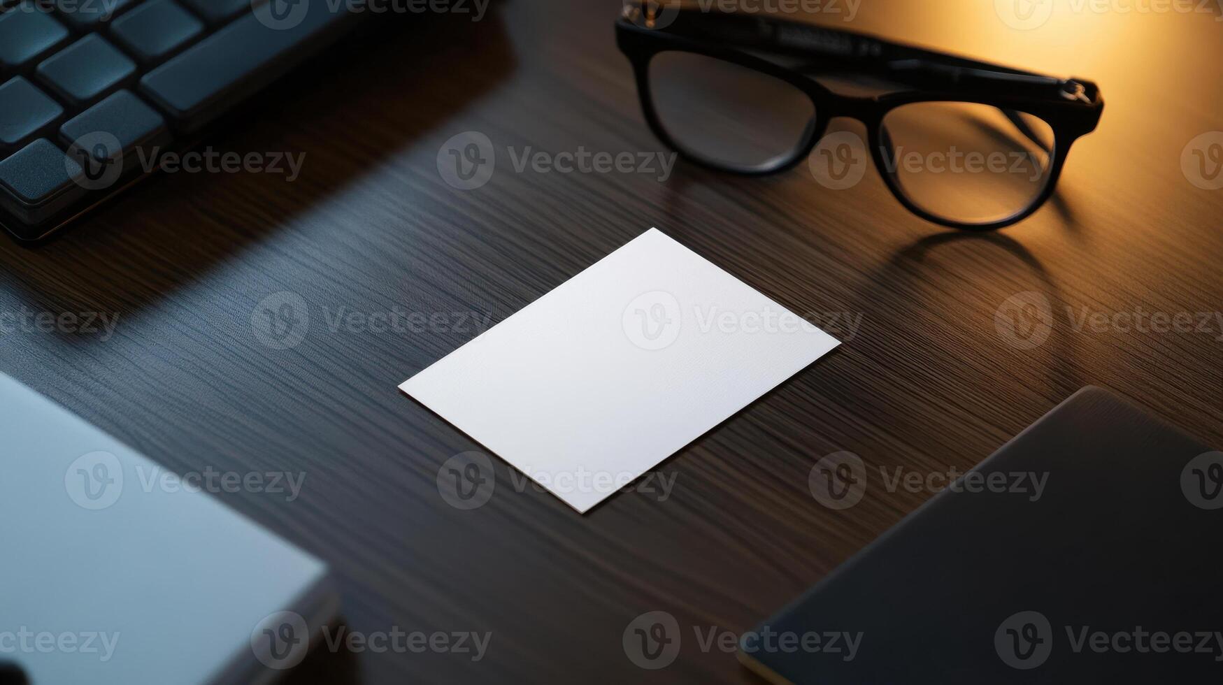 blank business card on modern desk with glasses photo