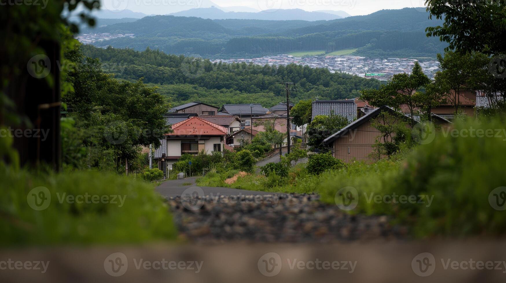 serene small town nestled in lush greenery and hills photo