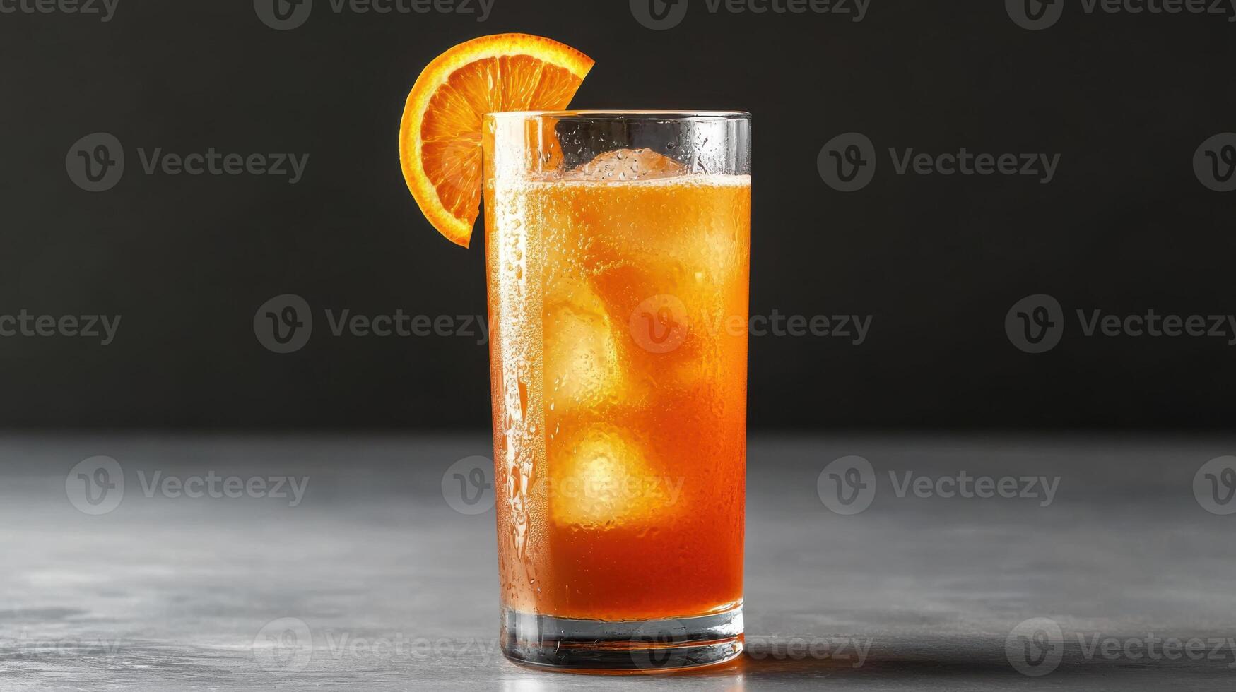 Fresh orange juice with ice and slice of orange garnish photo
