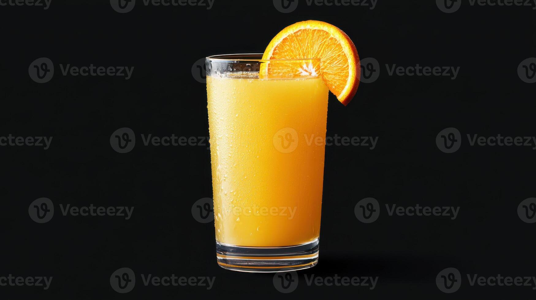 Fresh orange juice in tall glass with slice of orange photo