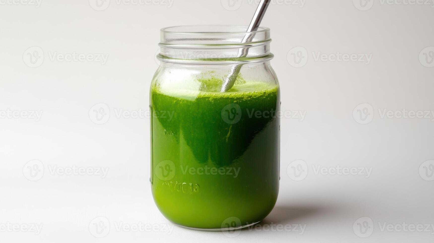 Fresh green juice in jar with metal straw photo