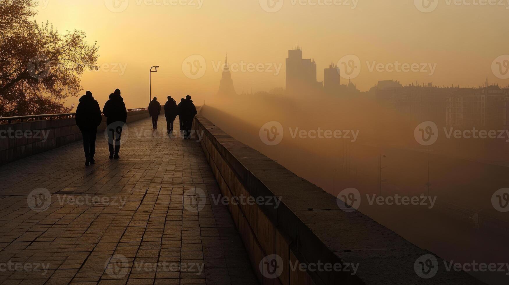 foggy morning with people walking on bridge photo