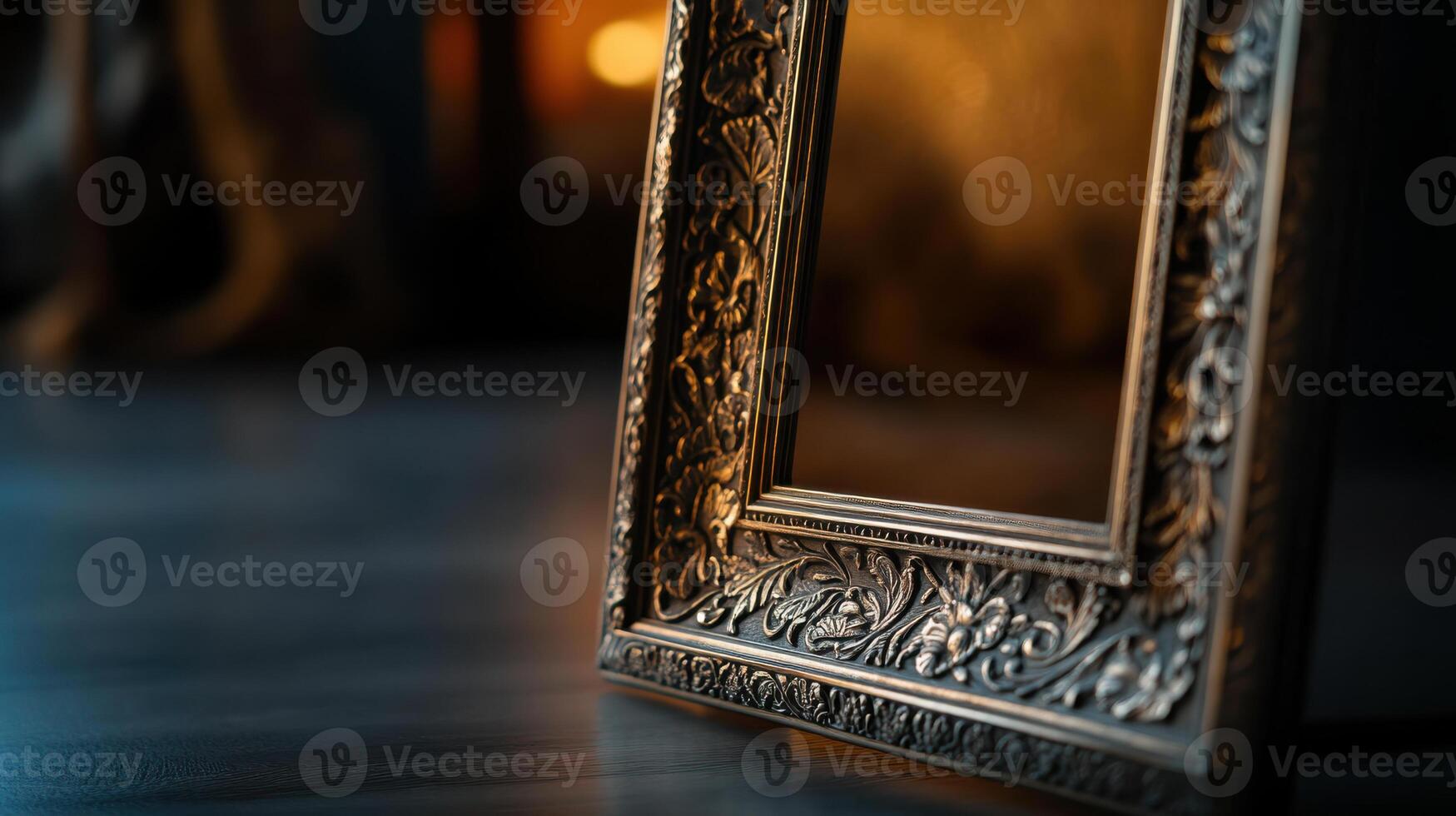 An ornate frame sits on a wooden floor photo