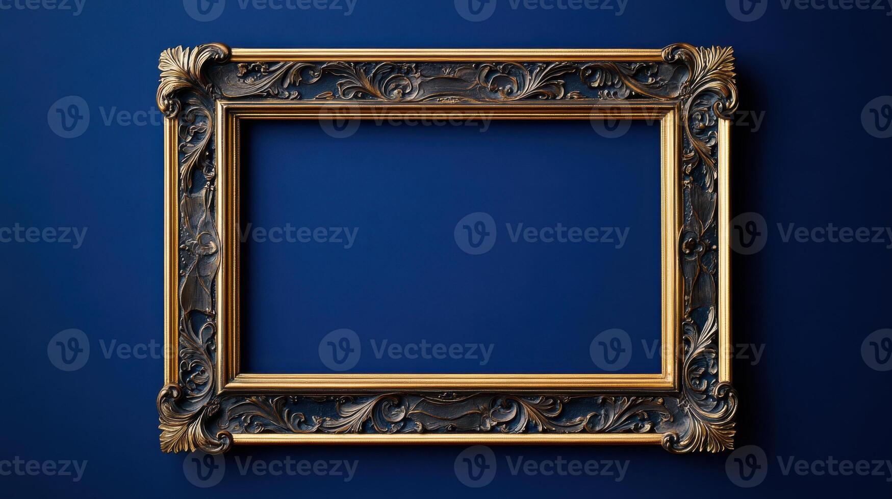 Gilded Baroque style picture frame on blue background photo