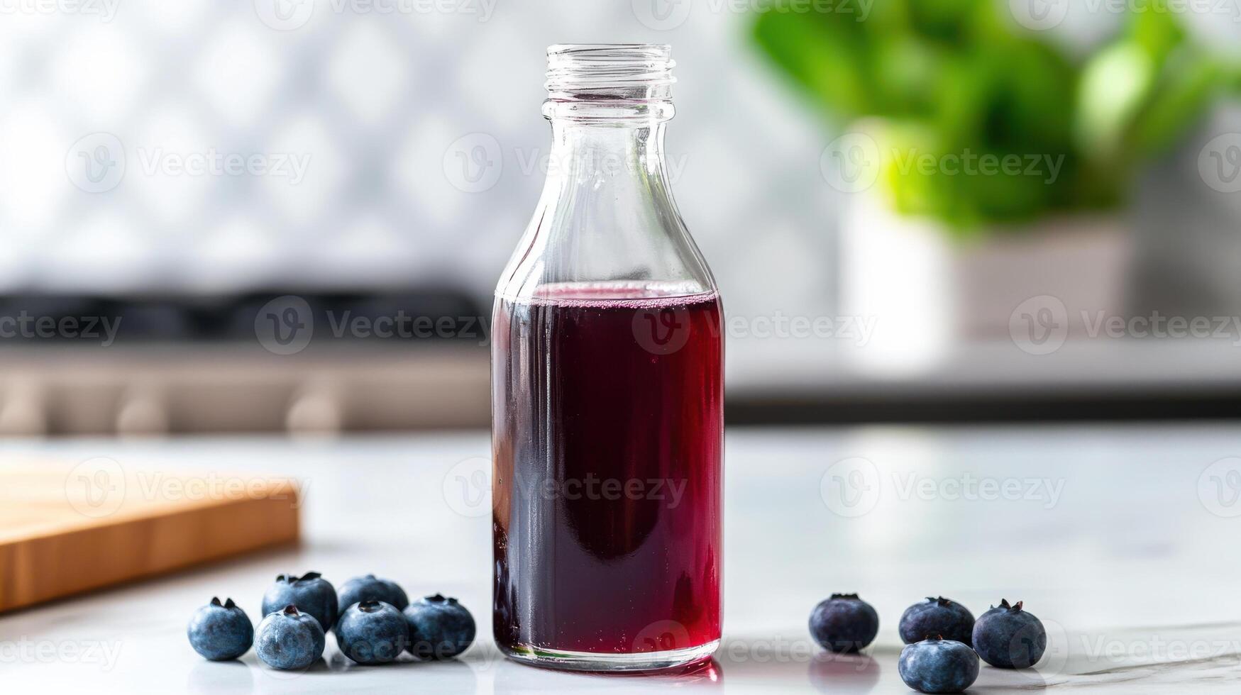 A bottle of blueberry juice sits on a counter photo