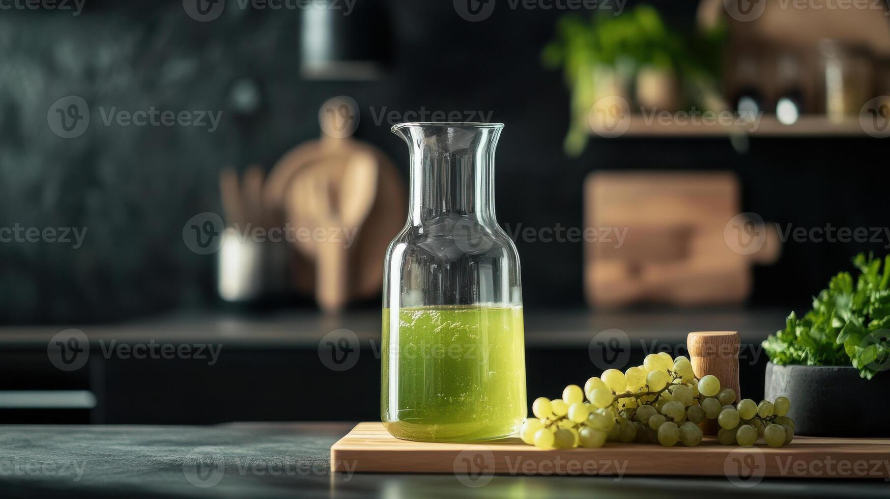 Fresh grape juice in glass carafe with grapes on table photo