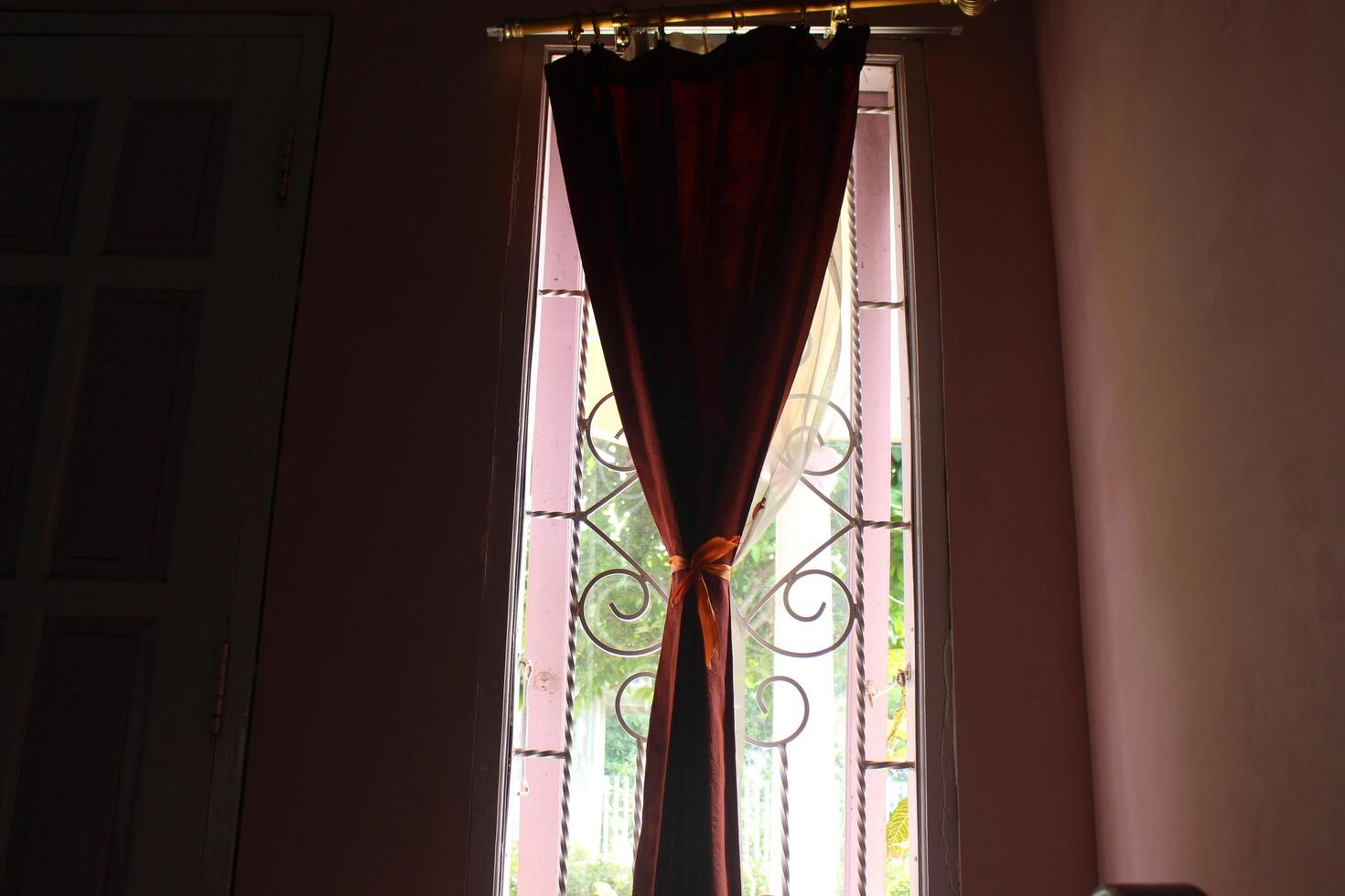 A window with a curtain photo