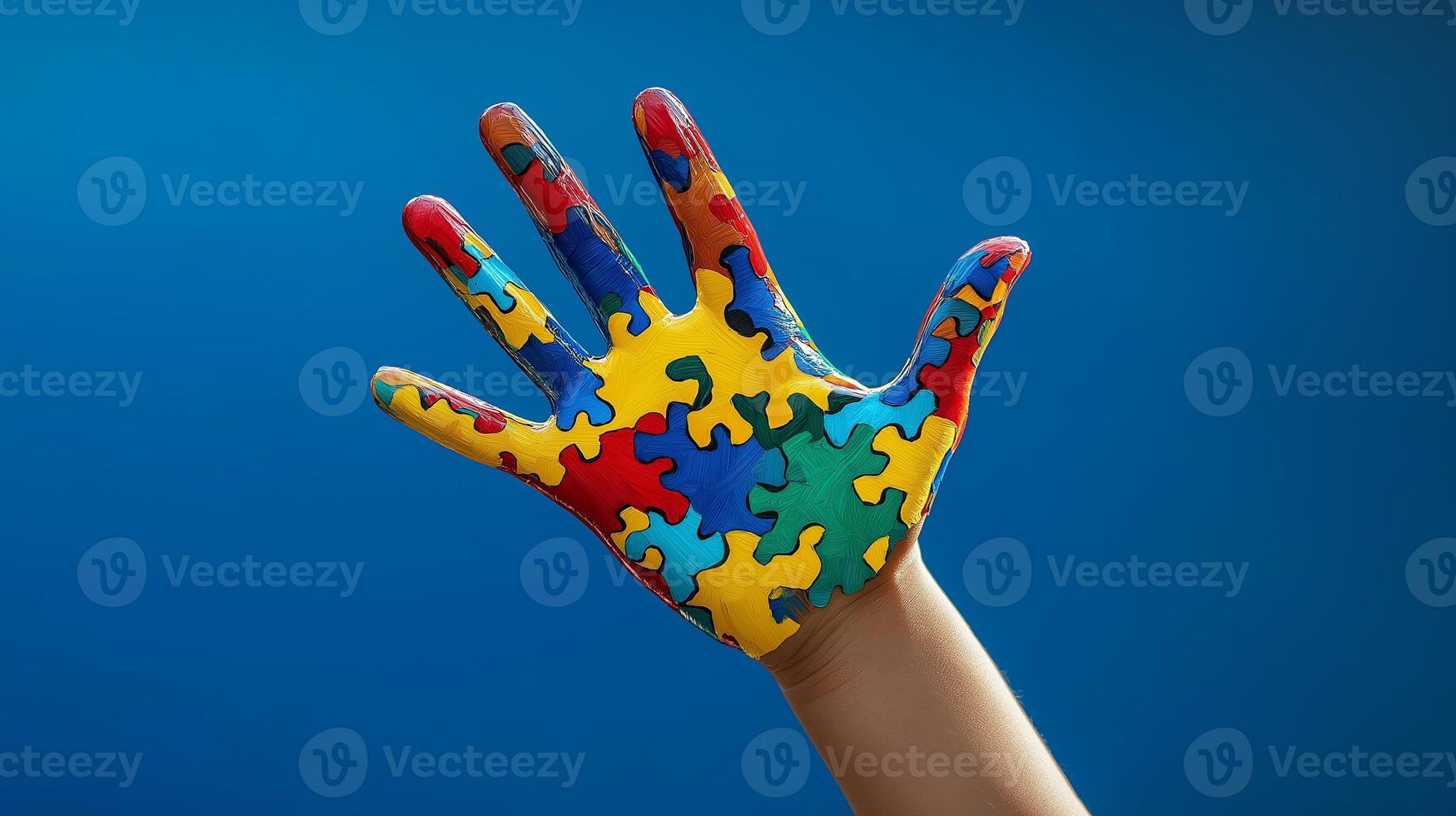 Vibrant puzzle piece hand raised against a blue background photo
