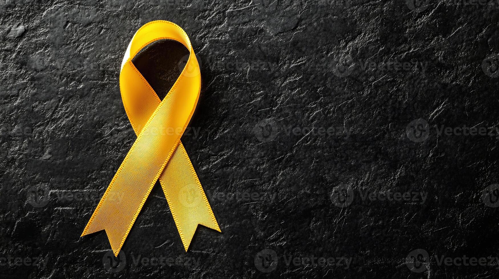 A single yellow ribbon with a gentle fabric texture, symbolizing remembrance, awareness, and showing care for important social issues. photo
