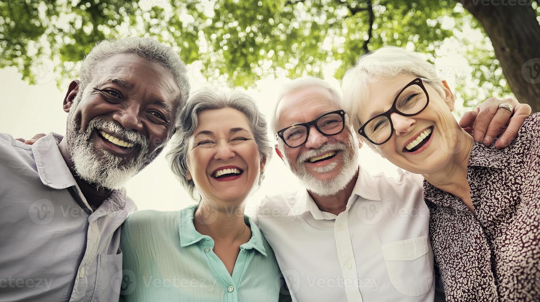 A diverse group of elderly friends smiles and laughs together in a park, symbolizing friendship, happiness, and a joyful lifestyle. photo