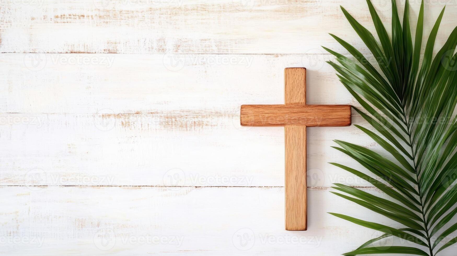 A simple wooden cross placed on a white wooden background with palm leaves, symbolizing Palm Sunday, Easter, and Christian faith. photo