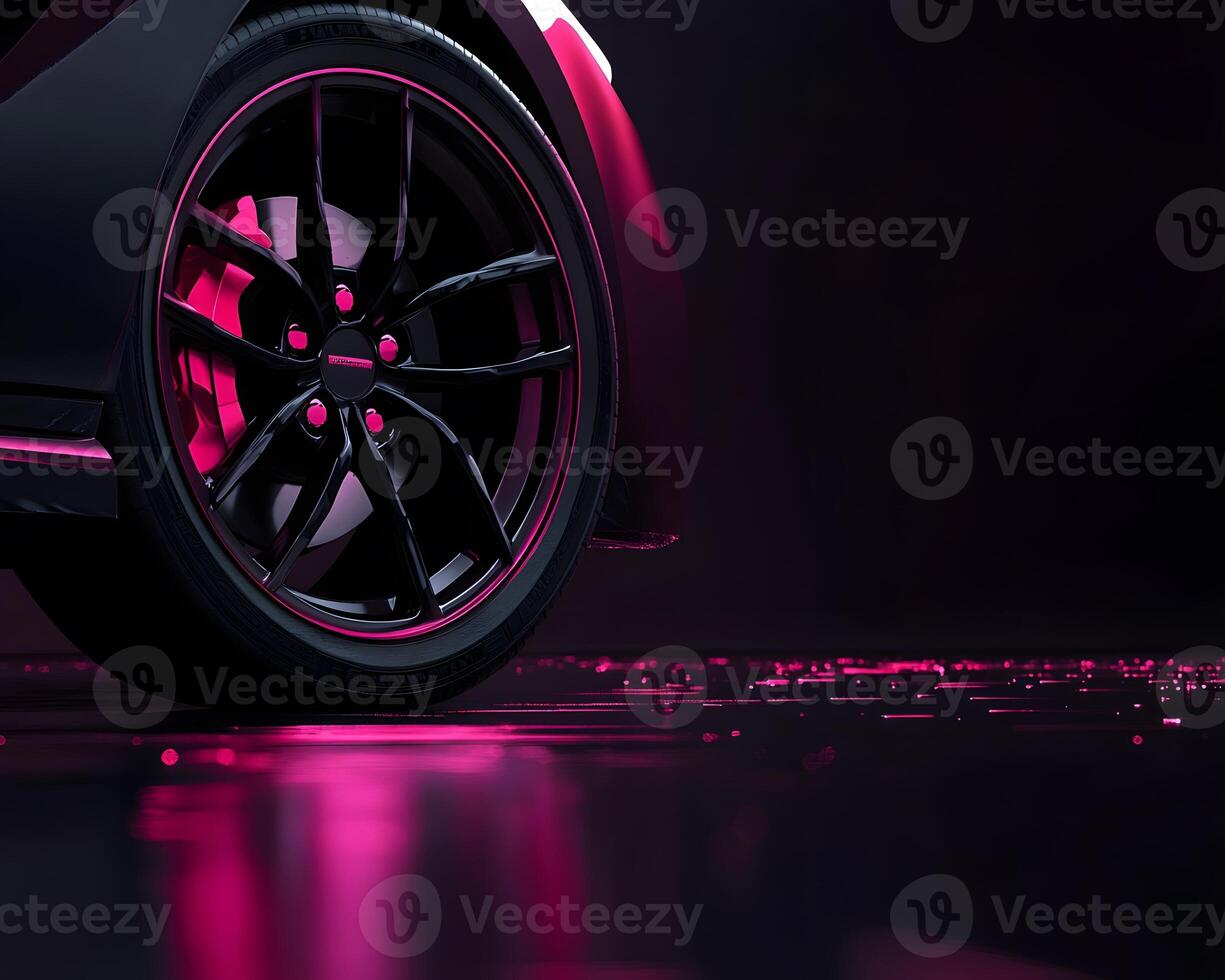 Black Car Wheel with Pink Accents and Reflective Surface photo