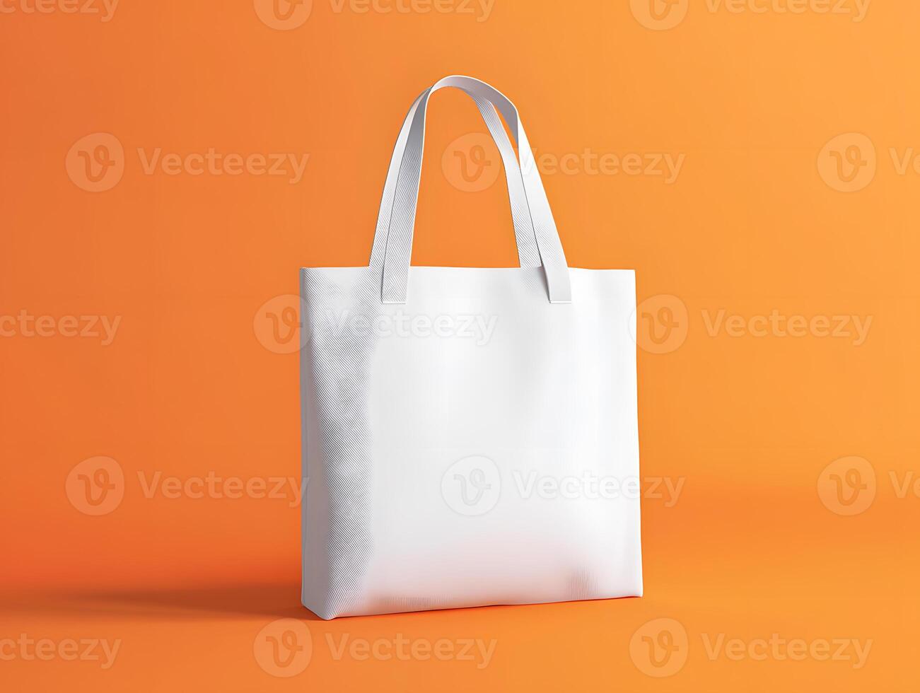 White Canvas Tote Bag Mock up Against Orange Background photo