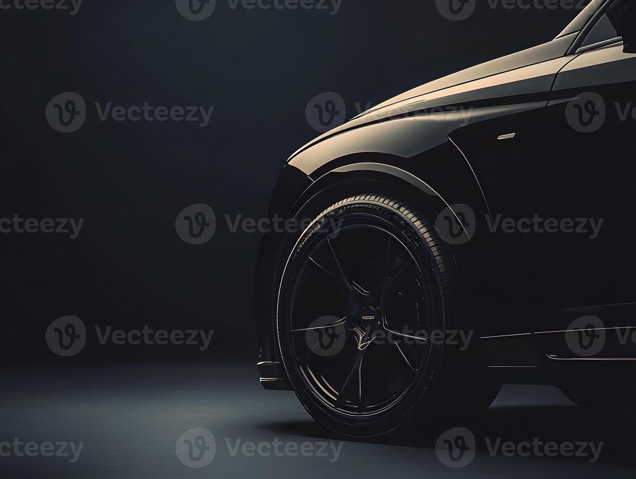 Black Luxury Car Front Wheel and Fender Detail photo