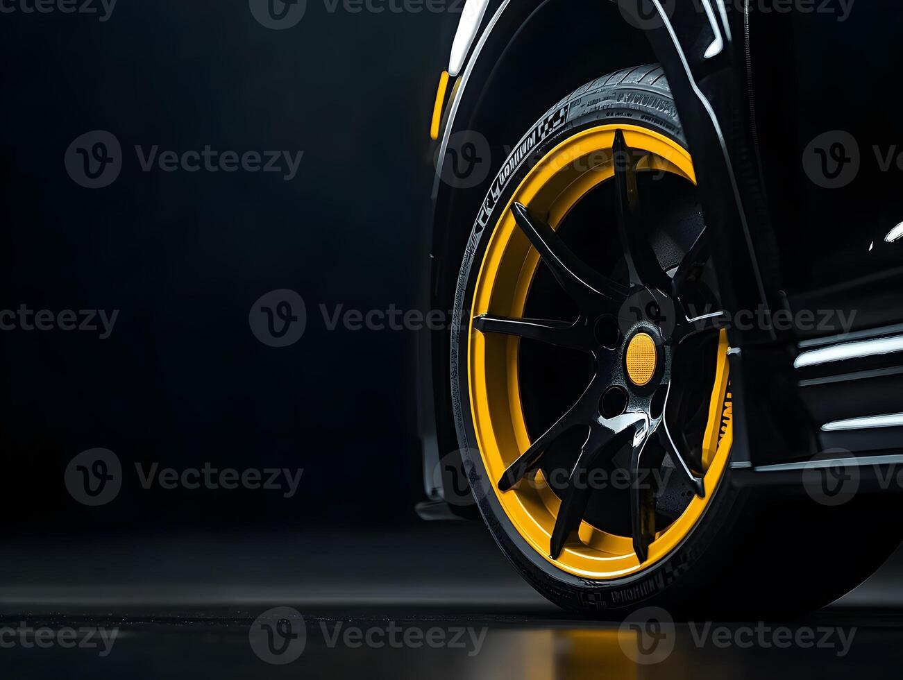 Black Car Wheel with Yellow Rim and Tire photo