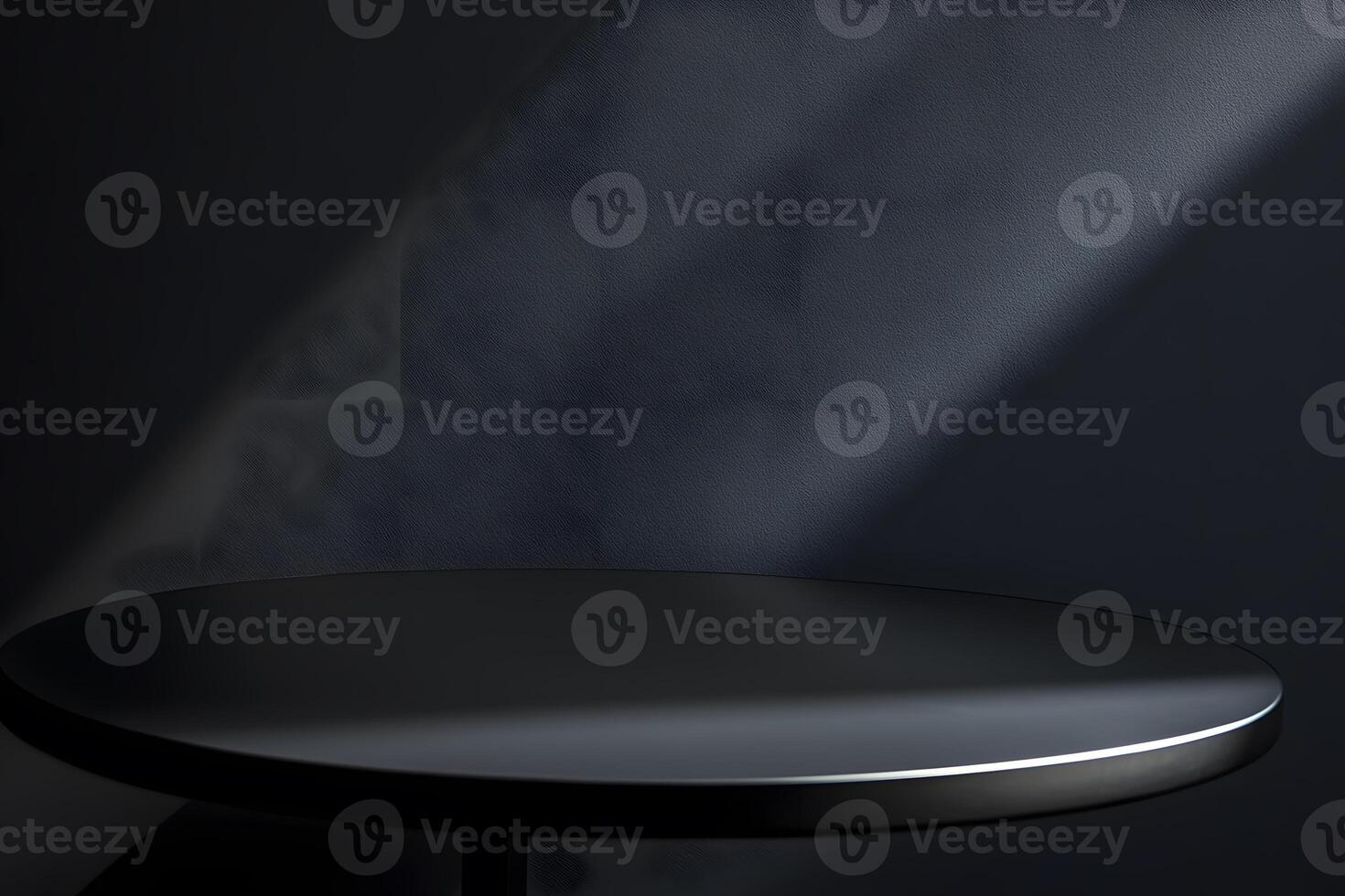 Black Circular Table and Textured Wall in Low Light photo