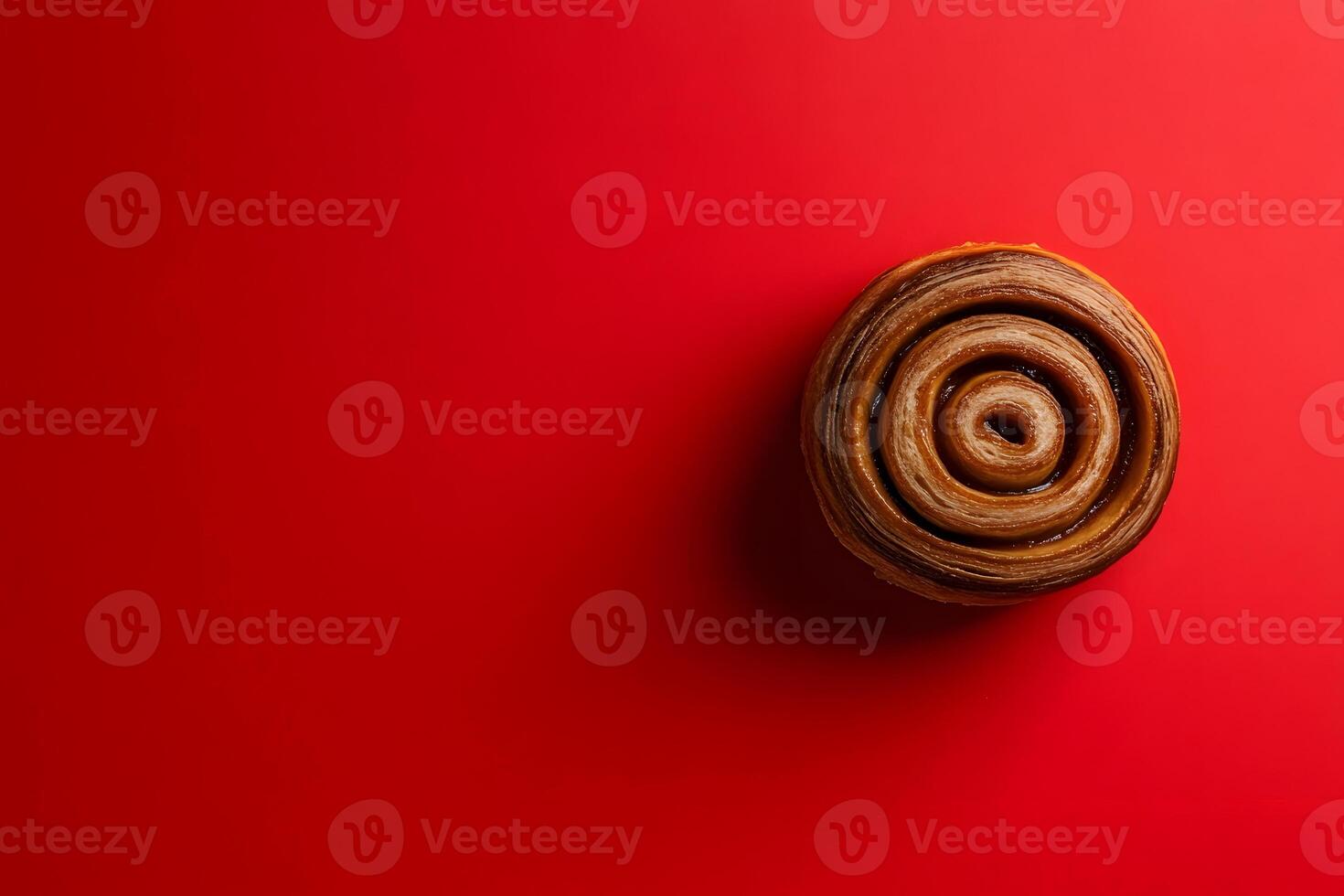 Cinnamon Roll on a Red Background photo