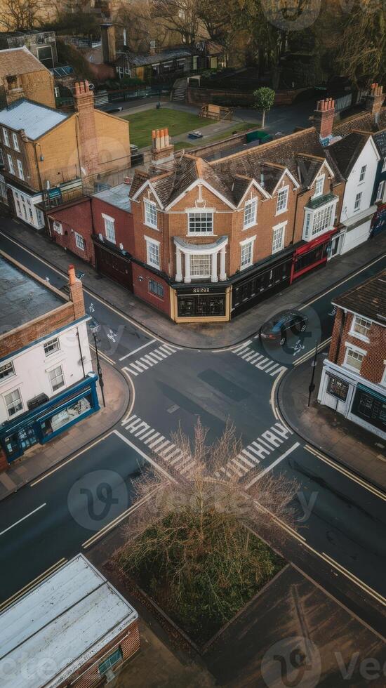 An aerial view of a town with a street crossing photo