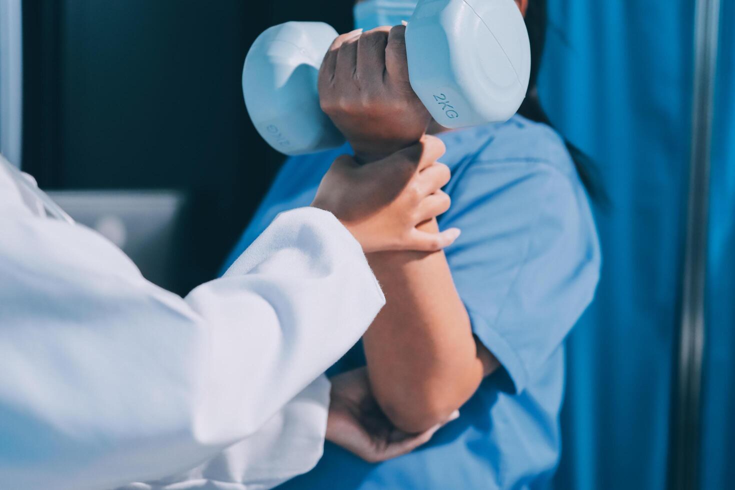 A doctor is holding a dumbbell in front of a woman photo