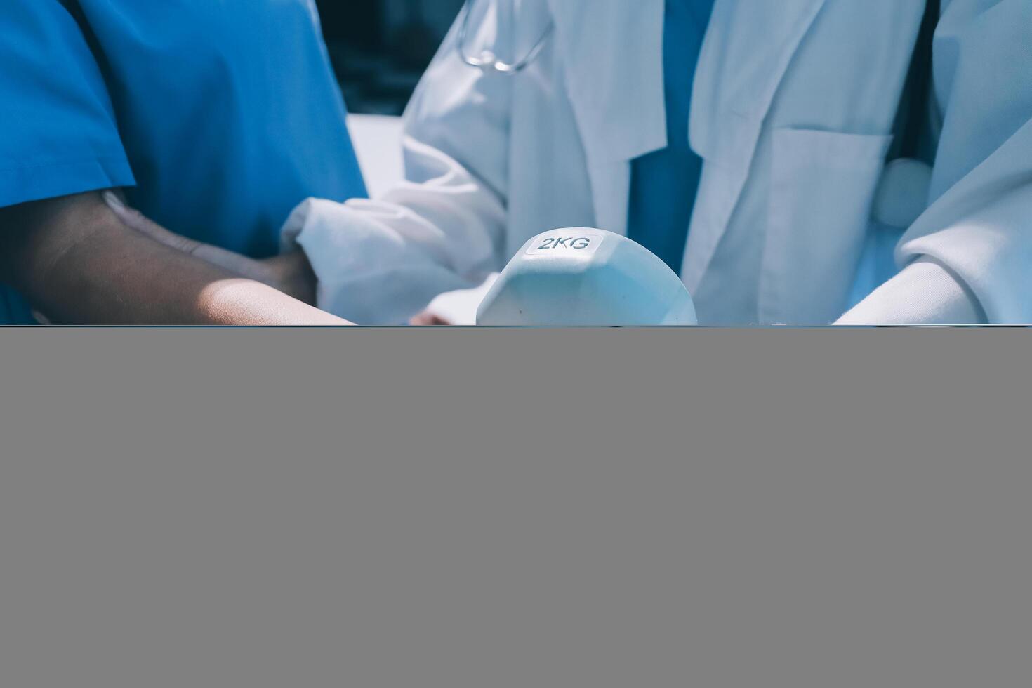 Two doctors holding a white object in front of them photo