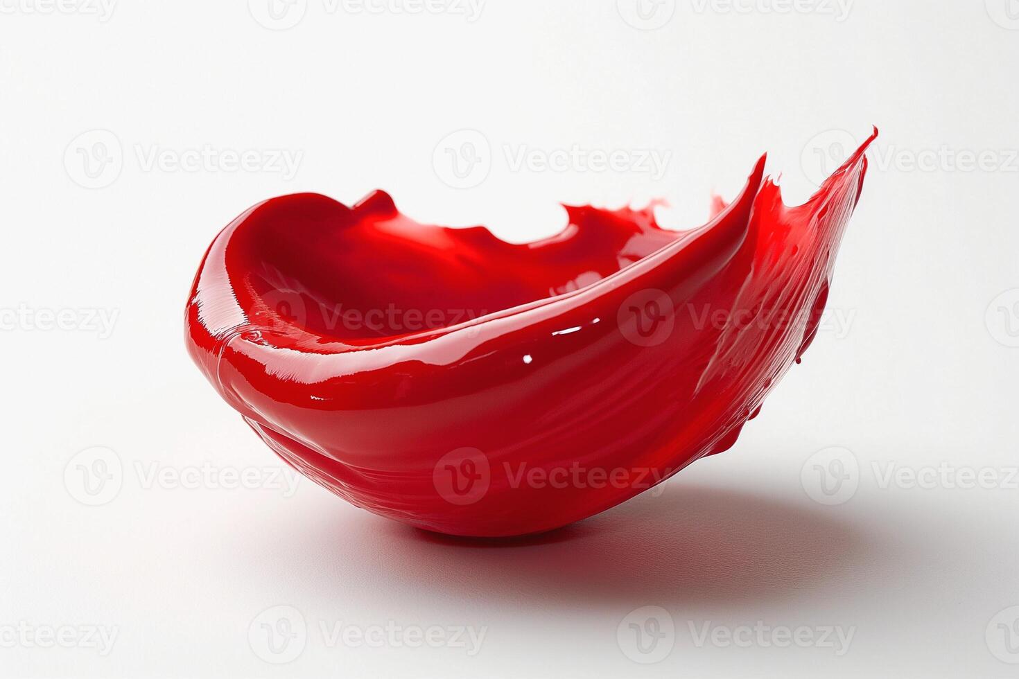 Vibrant red paint splashing elegantly on a white surface, creating an artistic and dynamic visual composition. photo