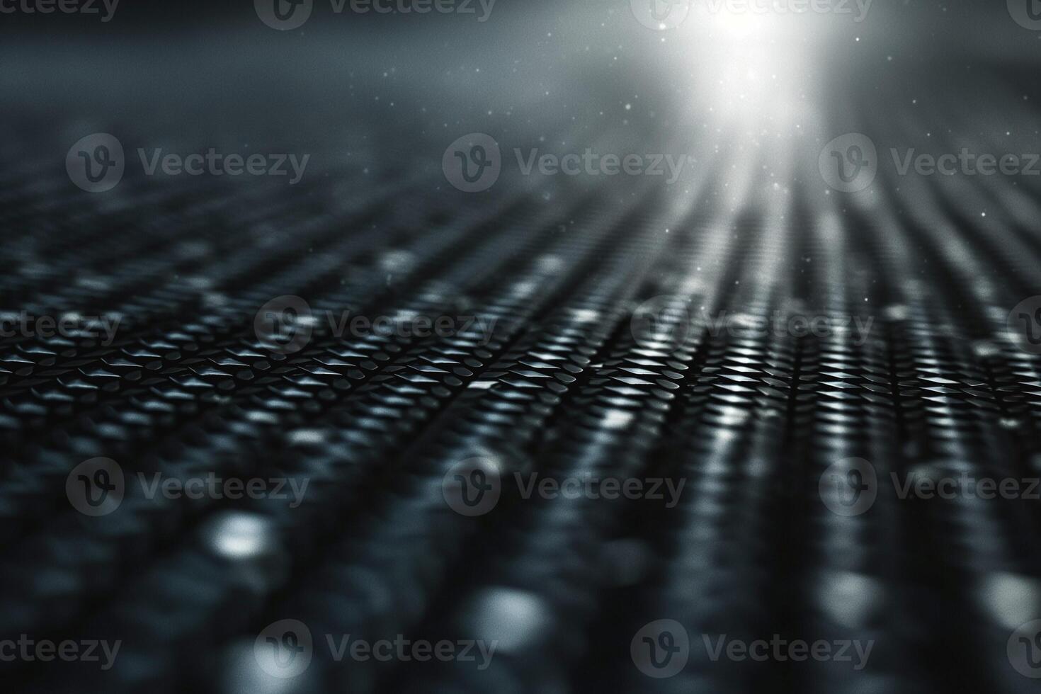 Abstract close-up of textured black surface with light reflections, creating a mysterious and atmospheric mood. photo