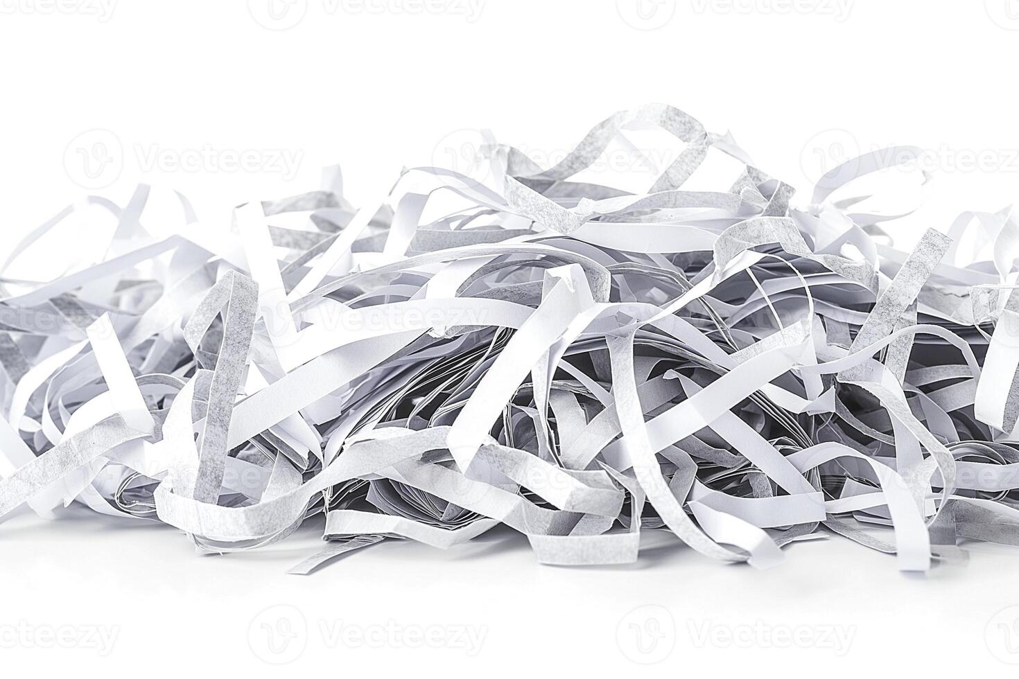 A pile of white and gray shredded paper, creating an abstract texture effect. photo