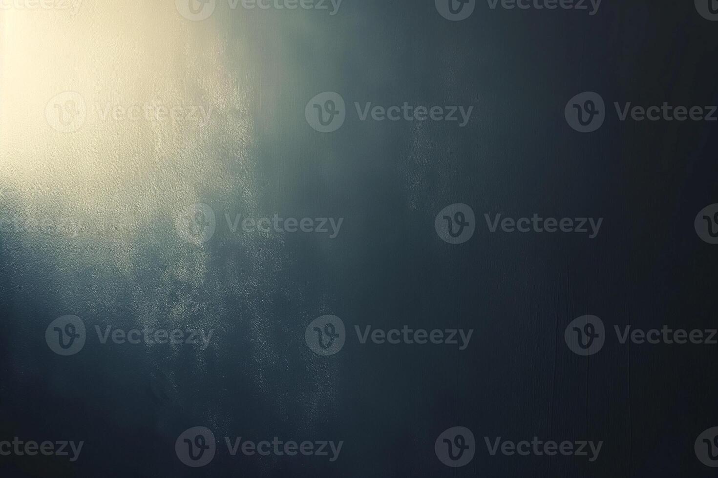 A textured gradient of dark blues and subtle light, creating a moody, abstract background. photo