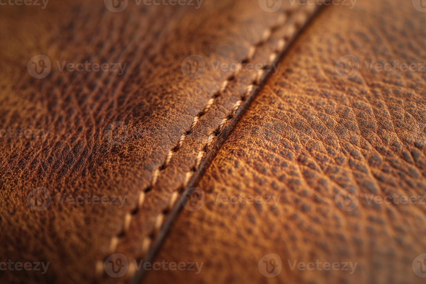 A close-up view of textured brown leather showcasing intricate stitching details. photo