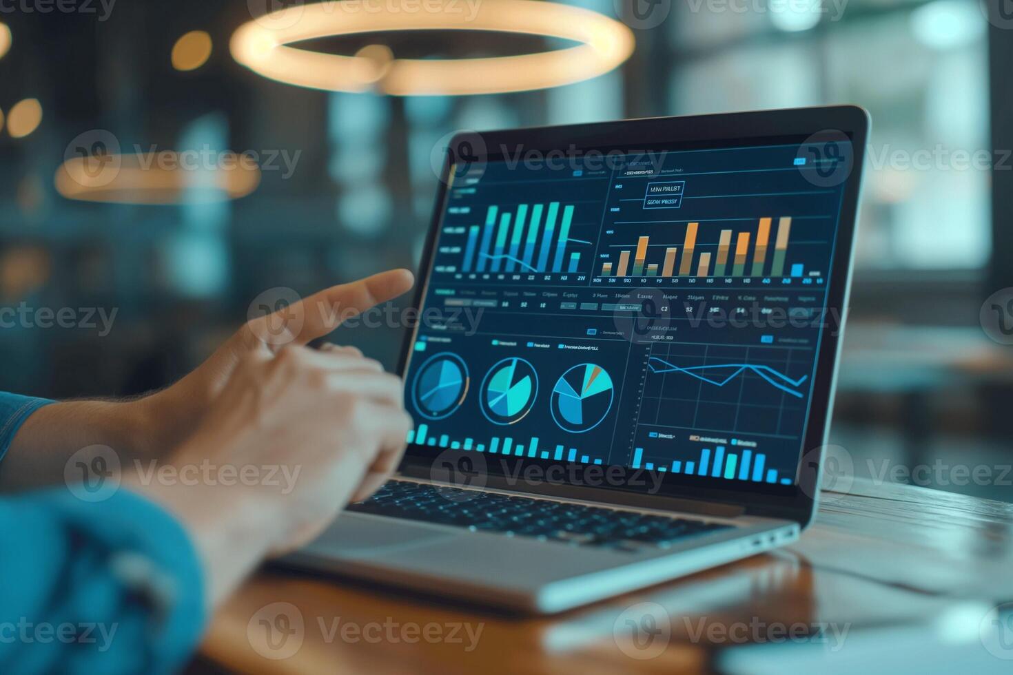 A business professional analyzing data on a laptop, showcasing vibrant graphs and charts in a modern workspace. photo