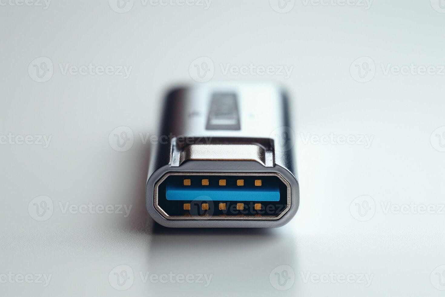 Close-up of a silver USB flash drive with blue accent, emphasizing its modern design and technology. photo