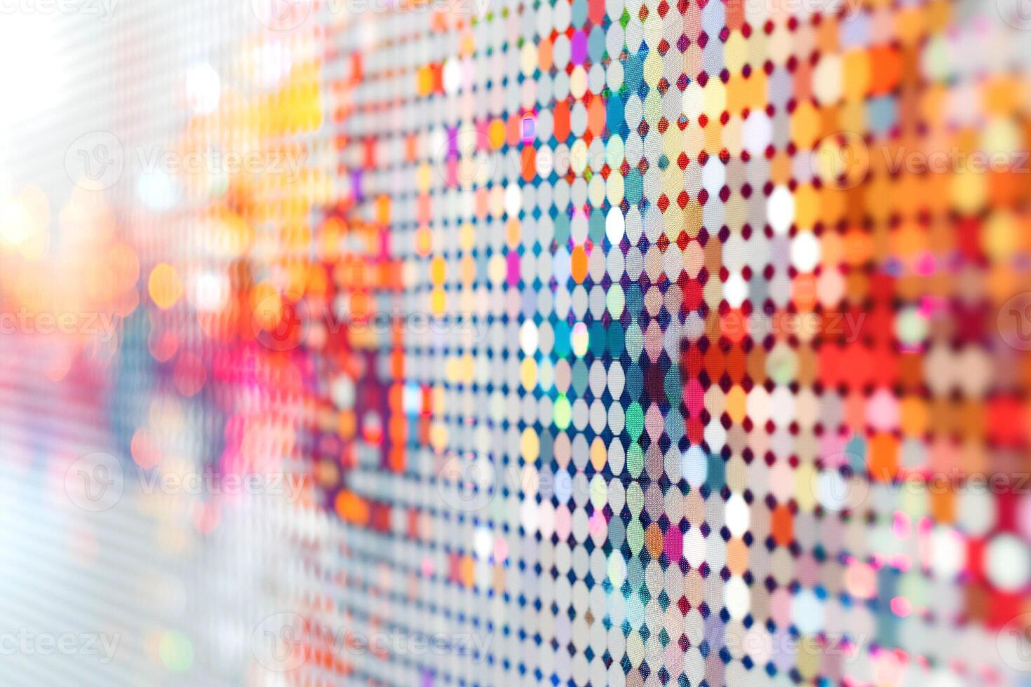 Colorful abstract pattern with vibrant dots reflecting light. photo
