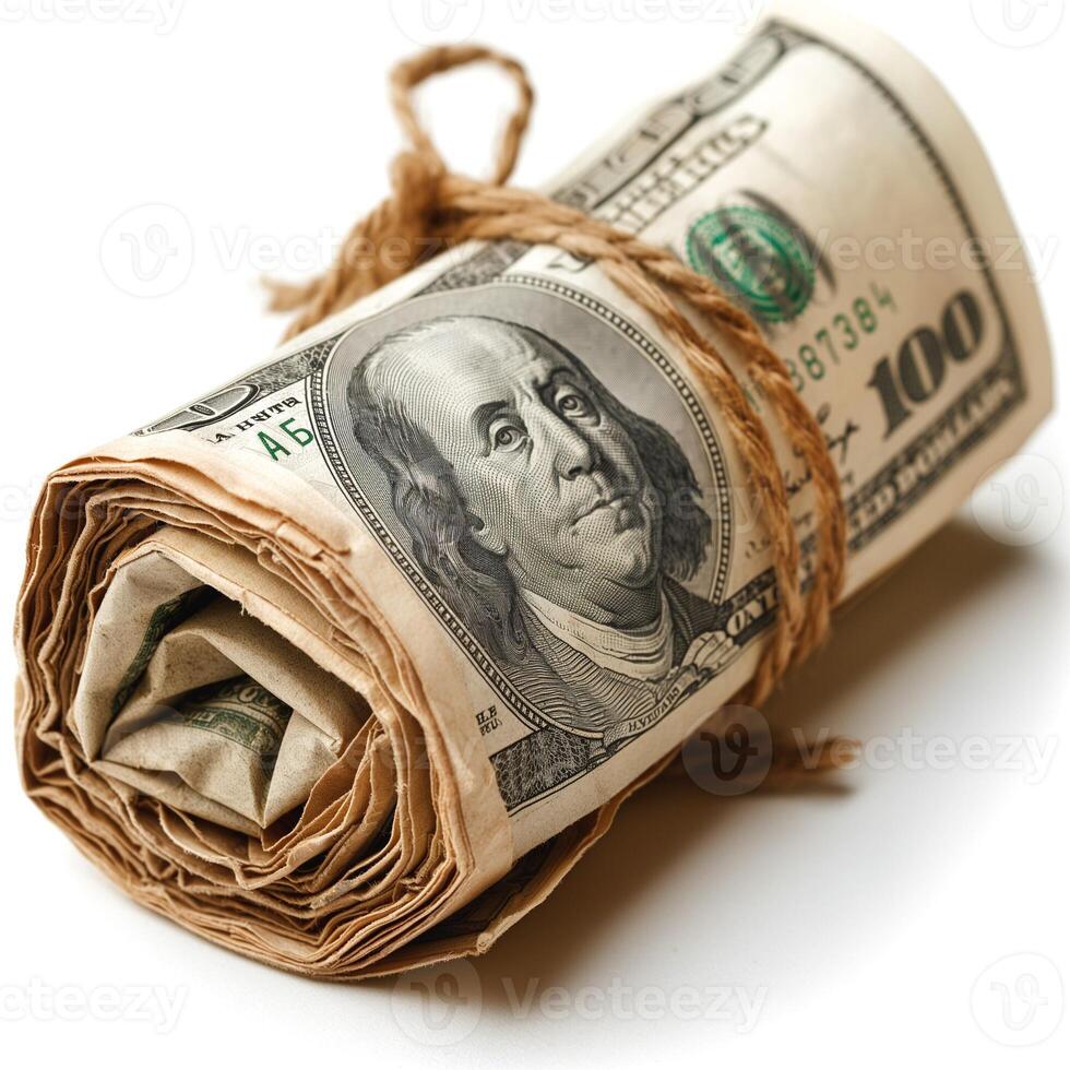 A tightly rolled bundle of U.S. currency featuring hundred-dollar bills, tied with twine for a rustic look. photo