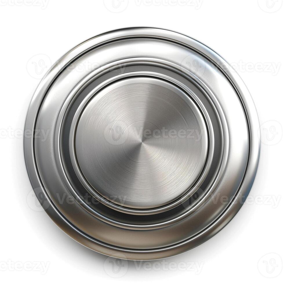 Close-up of a shiny, metallic round plate showcasing a series of elegant concentric circles. photo