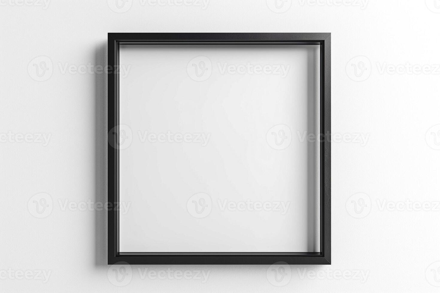 A minimalist black frame hanging against a white wall, ready for artwork. photo