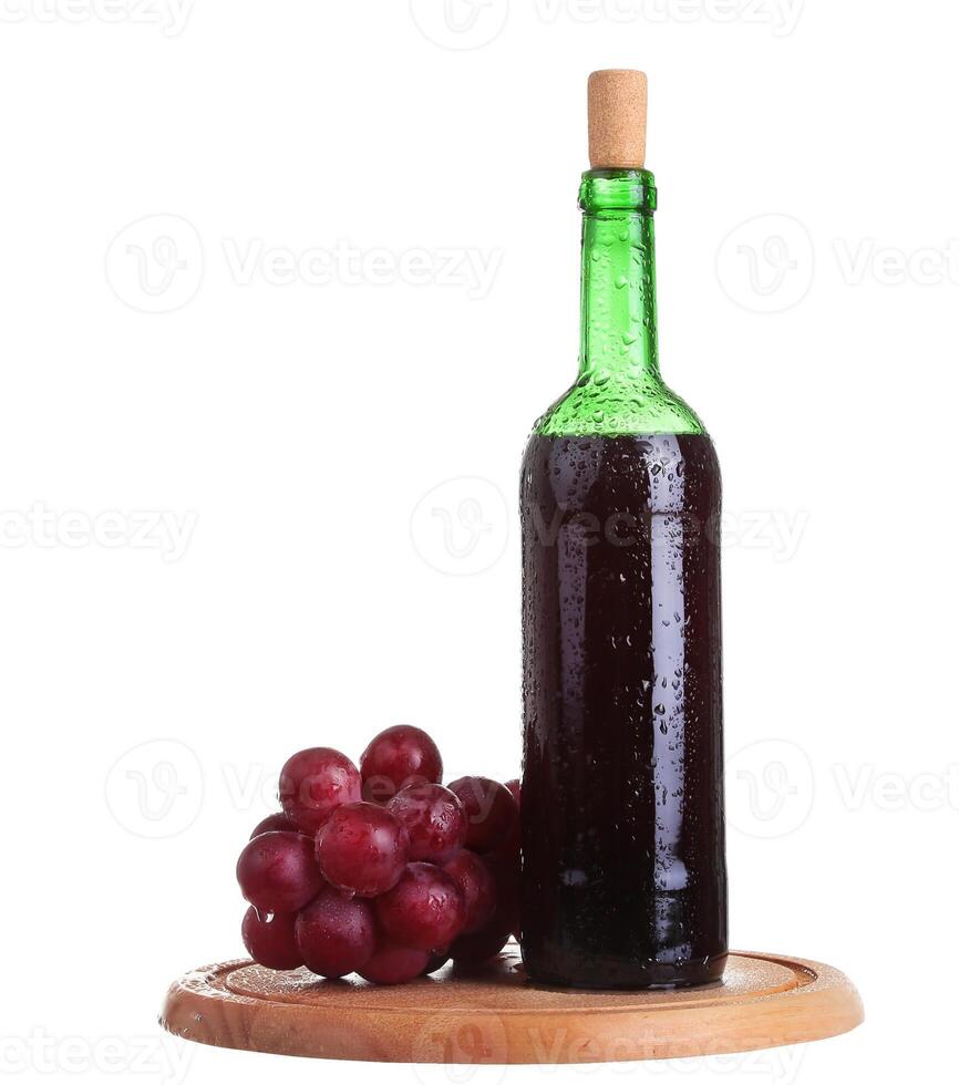 red wine bottle of wine and grapes isolated over white background photo