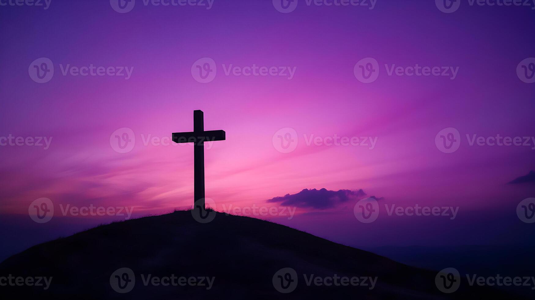 Silhouette of cross against a purple sky, symbol of faith, hope and love photo