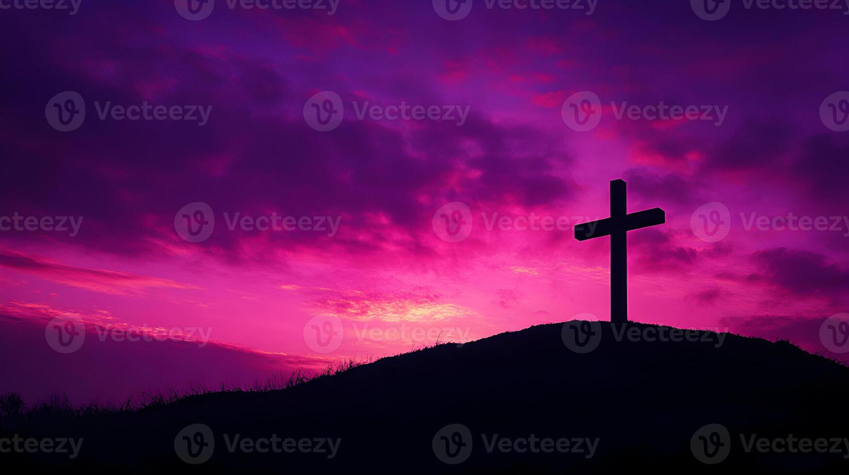 Silhouette of a Cross on a Hill Against a Vibrant Pink and Purple Sunset Sky photo