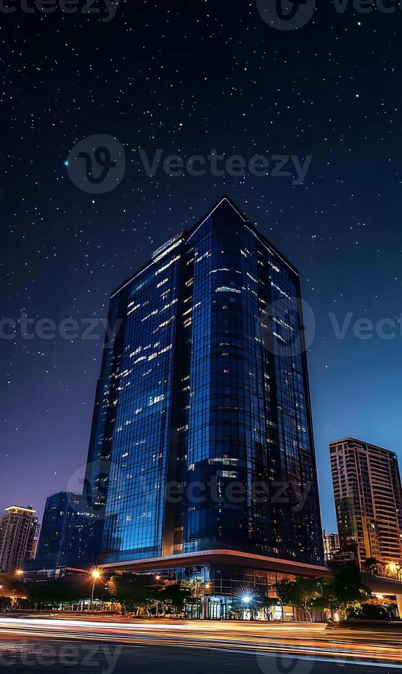 Cityscape at night with a modern building illuminated under a starlit sky serene urban view photo
