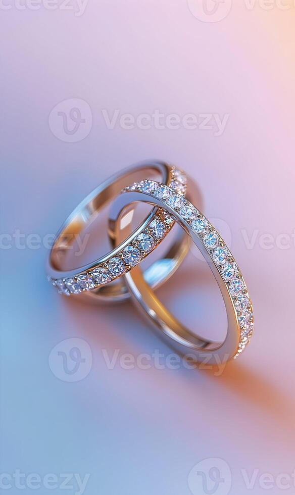 Elegant intertwined diamond wedding rings in warm and cool tones with soft gradient backdrop photo