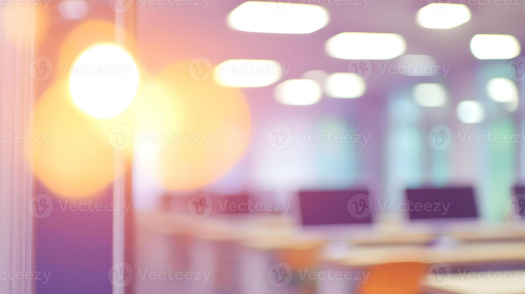 Blurred vision of a modern computer lab with rows of monitors and keyboards in a learning center photo